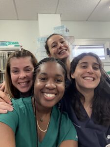 A selfie of four women who work at a veterinary clinic.