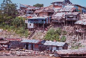 A slum today. Slums built along rivers that are constantly polluted by urban waste, agricultural runoff, and chemical effluents. In 19th Century London, slums were run-down parts of the city.