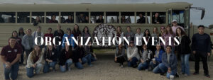 pre-vet members pose inside and in front of a buss at Aggieland Safari during a group event