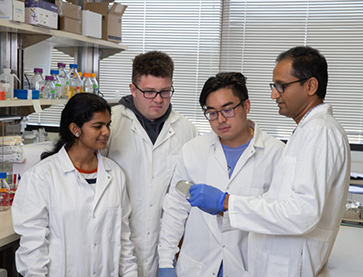 Dr. Subash and students in the lab