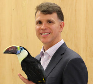 Dr. Scott Echols holding a toucan