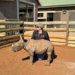 Me with an orphaned baby rhino. 