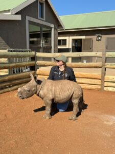 Me with an orphaned baby rhino. 