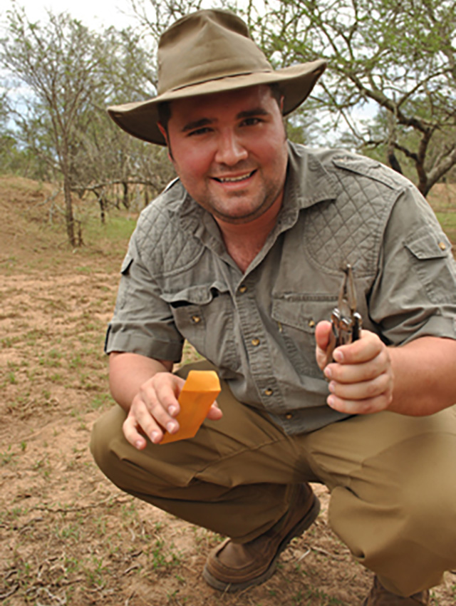 A graduate student shows how to take wildlife conservation samples.