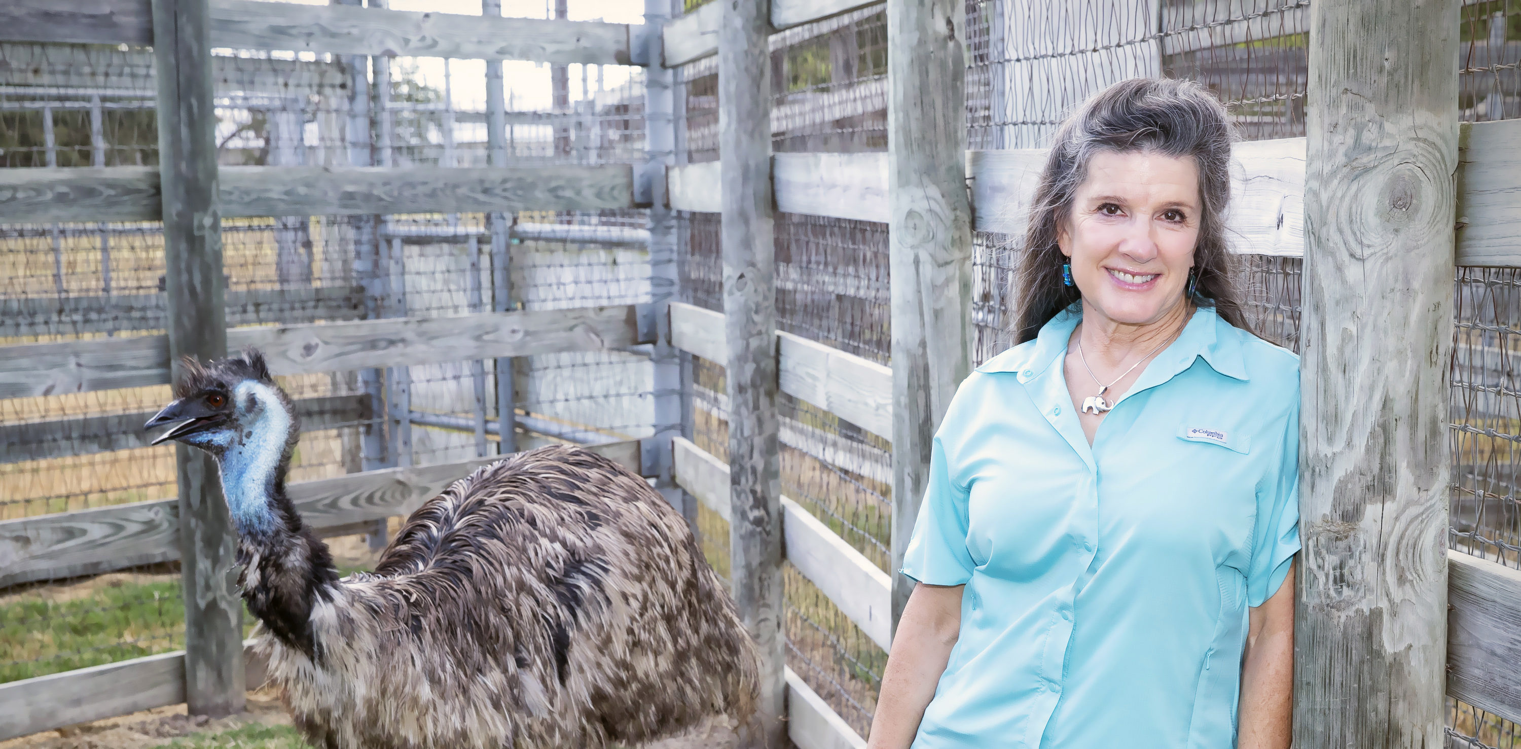 Dr. Alice Blue-McLendon, Center Director, visits with an emu at the Winnie Carter Wildlife Center